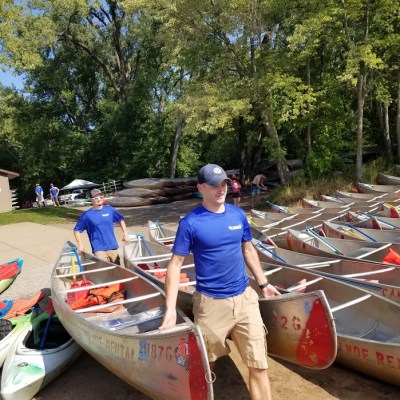 a person riding on the back of a boat