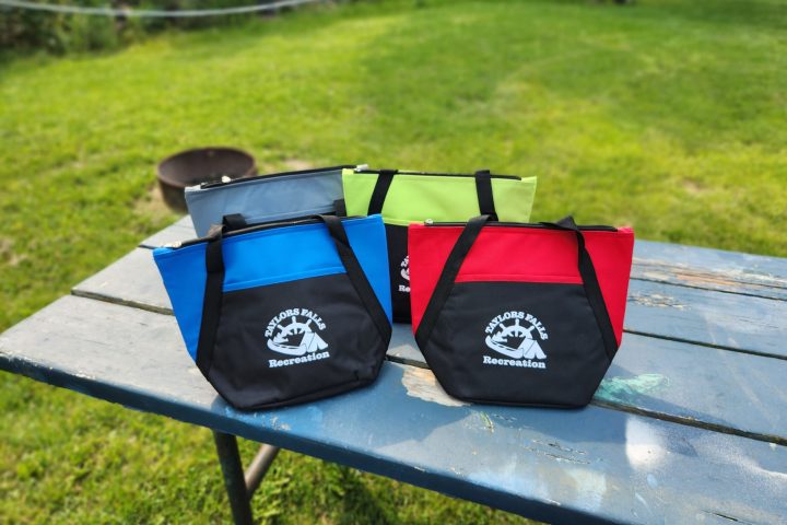 a bag sitting on top of a bench in a park