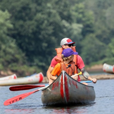 a group of people riding on the back of a boat