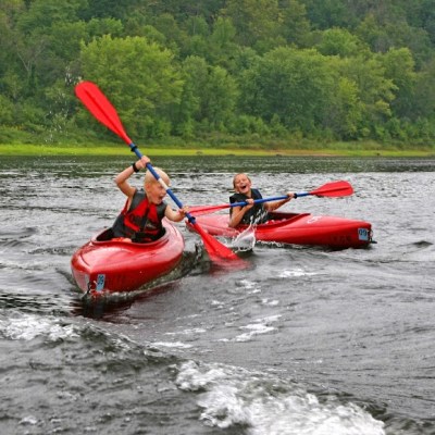 a group of people on a raft in a body of water