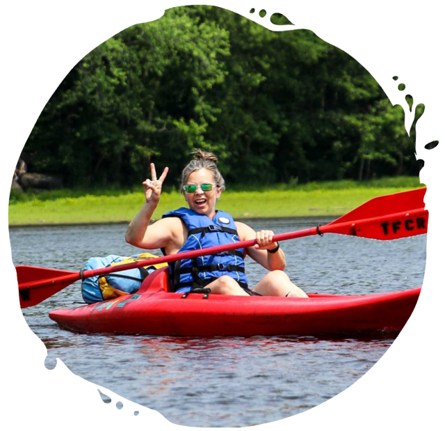 a person riding on the back of a boat