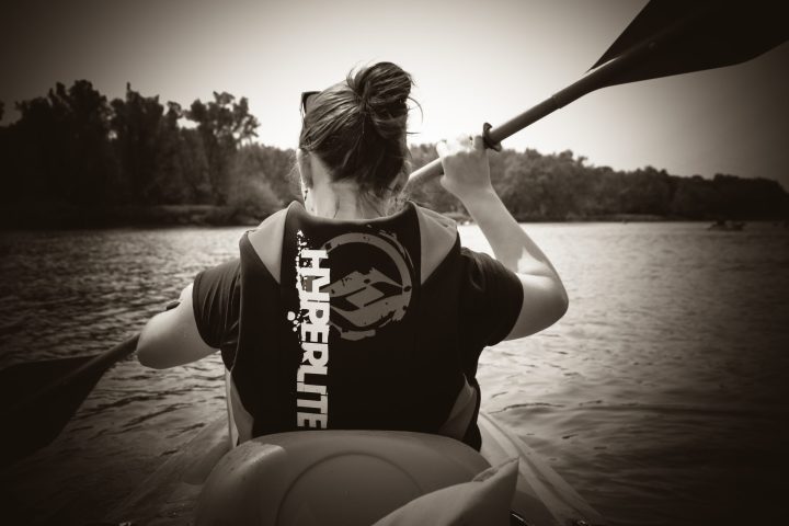 a person standing in front of a body of water